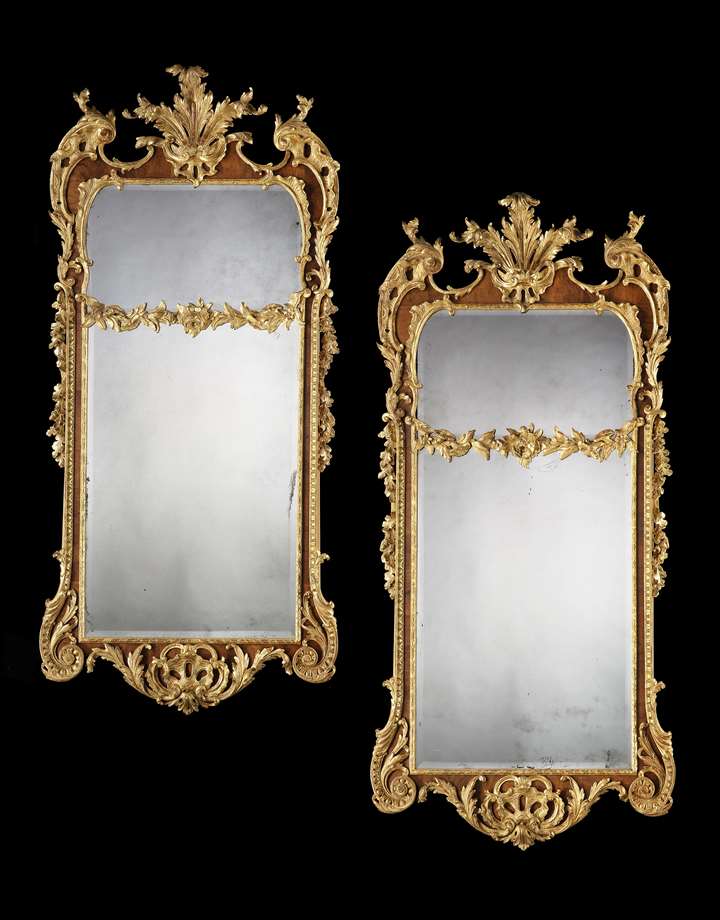 A PAIR OF GEORGE II PARCEL GILT WALNUT PIER MIRRORS